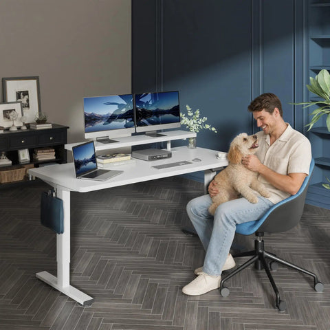 Adjustable Height Standing Desk With Raised Monitor Platform And Sleek Cable Tray For A Sick Home Office Setup That Will Keep Your Workspace Dope And Totally Clutter Free, featuring dual monitors and a man with a dog.