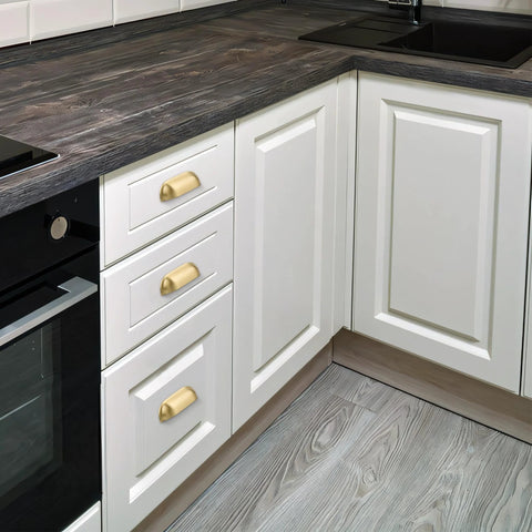 Brushed Matte Gold Brass Cabinet Drawer Pulls Pack Of Two And A Half Inch Center To Center Solid Knobs installed on white kitchen cabinets.