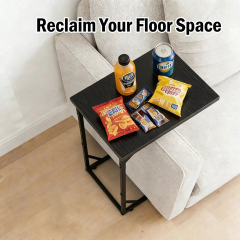 C Shaped End Table That Slides Under Sofa For Small Spaces A Handy Side Table For Living Room Or Bedroom Perfect For Laptop Coffee Snacks Remote And Light Tasks Easy Assembly Modern Design with snacks and drinks on top next to a sofa.