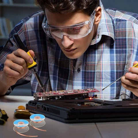 Technician using Six Pack 5Ft Solder Wick Braided Desoldering Wicks With Flux No Clean For Electronics PCB Repair on circuit board