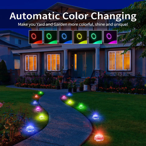 Colorful Sun Powered Solar Ground Lights 12 Pack with 8 LED In-Ground Disk Lights along a pathway at night