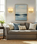 Vintage Linen Fabric Brass Gold Wall Sconce Light for Hallway, Bedroom beside a sofa and artwork in a bright living room.