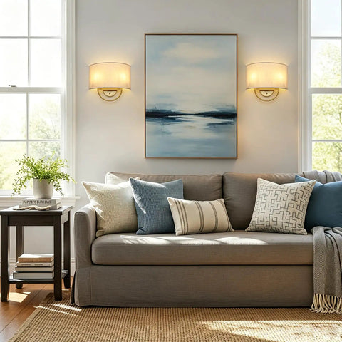 Vintage Linen Fabric Brass Gold Wall Sconce Light for Hallway, Bedroom beside a sofa and artwork in a bright living room.