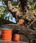 Arborist Throw Line Kit With 15 Oz Throw Weight And 196 Ft Paracord Rope, visible against tree for precise climbing setup