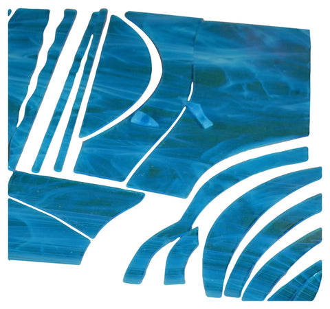 Blue cut glass pieces from Glass Cutting Kit With Cutter And Drill Bits For Bottles Blocks And Quarter Plates 2 In 1 Tool