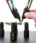 Person using 4x SQ10 Digital Probes with test wires for electronics prototyping and repairs kickass readouts and steady probing.
