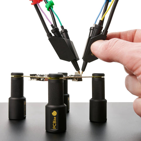 Person using 4x SQ10 Digital Probes with test wires for electronics prototyping and repairs kickass readouts and steady probing.