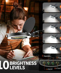 Woman using 10X Magnifying Lamp With Light And Stand For Crafts, Reading And Close Work, Dimmable LED Desk Magnifier in library.