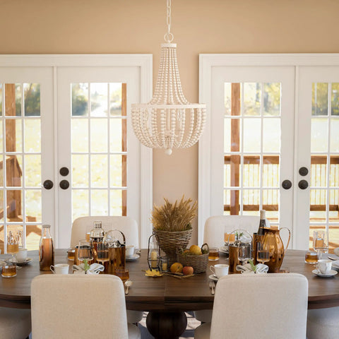 Dumas 3 Light Coastal Boho Chandelier With Weathered White Beads And Exposed Bulbs For A Cozy Vibe above dining table