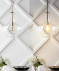 Brass Gold Clear Mid Century Modern 1 Light LED Pendant Light Fixture With Adjustable Schoolhouse Hanging Stem For Kitchen Island Glass Shade LED Bulb Included Ships Fast, shown illuminated and off over dining table.