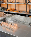 24 Piece Tip Electrode Kit For Cut 55DS Pro And Cut 65DS Plasma Cutters With Electrodes Nozzles Brass Zinc Alloy Stainless Steel Consumables For Smooth Precise Pro Grade Cuts shown on a workbench.