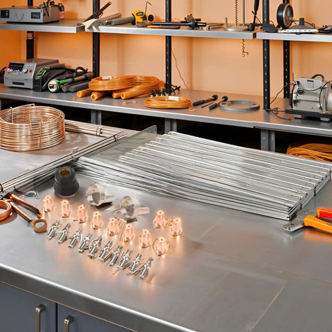 24 Piece Tip Electrode Kit For Cut 55DS Pro And Cut 65DS Plasma Cutters With Electrodes Nozzles Brass Zinc Alloy Stainless Steel Consumables For Smooth Precise Pro Grade Cuts shown on a workbench.