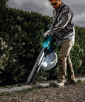 Person using 3-In-1 Cordless Leaf Blower Vacuum Mulcher, 18V LXT Brushless Tool Only on garden path