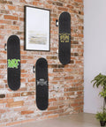 Heavy Duty Steel Skateboard Wall Mount Rack Secures Decks For Garage Storage Rad Display Setup And Shields Boards From Nasty Floor Scuffs While Daily Rolling, displaying three boards on a brick wall.