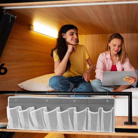 Compact Mesh Shoe Storage Hangs Beside Bed With 4 Hooks For RV Camper And Home To Stash Sneakers And Boots While Keeping Floors Tidy, gray mesh pockets displayed.