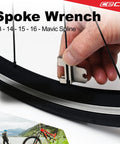 Hand adjusting bike spoke with Ultra Slim 17 Function Bike Tool With Chain Breaker, Pocket Sized Bicycle Multi Tool