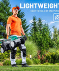 13 Inch Cordless Lawn Mower With 5 Height Settings 20V Brushless Motor Ideal for Garden Yard and Small Farm Lightweight No Fuss Walk Behind Includes 4Ah Battery And Charger For Quick Clean Cuts, man carrying mower