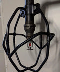 Heavy Duty Fire Sprinkler Head Protector Cage Welded Steel Impact Proof Design Fits 2.5 Inch Pipe Black Finish installed on a pipe.