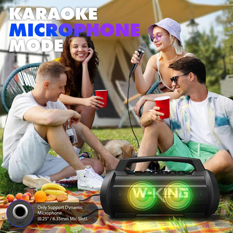 Group enjoying Party-Ready 120W Bluetooth Speaker With IPX6 Waterproof Build at outdoor event with LED lights and karaoke mode.