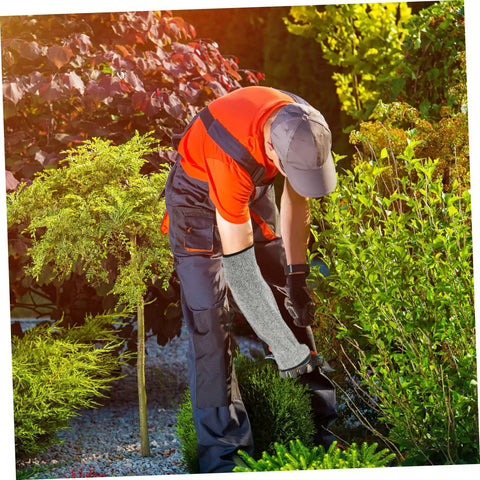 Tough As Nails Cut Resistant Arm Sleeve And Rip Proof Forearm Guard For Men And Women One Size Fits All worn by a gardener using tools.