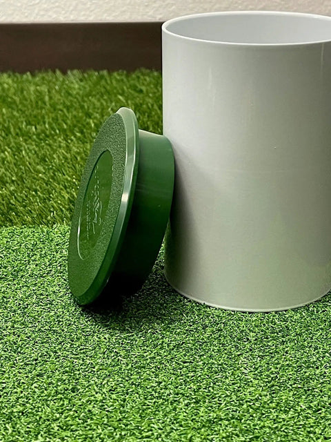 Aluminum Putting Green Cups 6 Inch Deep, 3 Pack Bundle, showing a white cup with green cover on synthetic grass.