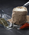 Commercial Grade Polycarbonate Ice Scoop 24 Ounce Clear Utility scoop shown with spices and flour on a dark surface
