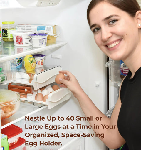 Person placing eggs in an Egg Holder For Refrigerator With 40 Egg Capacity Two Tray Plastic Design Includes Time Tracker Brush And Nonslip Lid Top No Fuss To Stack And Organize Your Fridge.