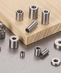 Slick Rolling Pack Of Eight Oilless Sleeve Bearings 5mm Bore By 7mm Outside Diameter X 20mm Length Aisi 52100 Steel Bushings on wood.