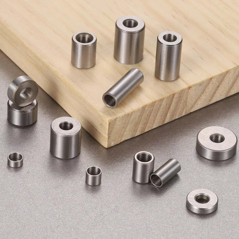 Slick Rolling Pack Of Eight Oilless Sleeve Bearings 5mm Bore By 7mm Outside Diameter X 20mm Length Aisi 52100 Steel Bushings on wood.