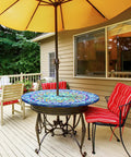 Outdoor table with mandala design tablecloth featuring an umbrella hole, hidden zipper, and elastic edge on a patio table.