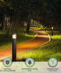 43 Inch Led Bollard Light Featuring Slick Beam Focus And Straight Up Adjustable Warm To Cool Temperature Settings For Top Notch Outdoor Yard Pathway Illumination And Heavy Duty Landscape Garden Accent Lighting in a rainy pathway setting.
