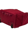 Red quilted underseat carry-on luggage with wheels, showing side mesh pocket, fits under airplane seats, 9x14x15 inches.