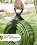 Heavy-Duty 28 Inch Storage Straps Set 2-Pack No-Fuss Hook And Loop Cord Carrier holding green garden hose