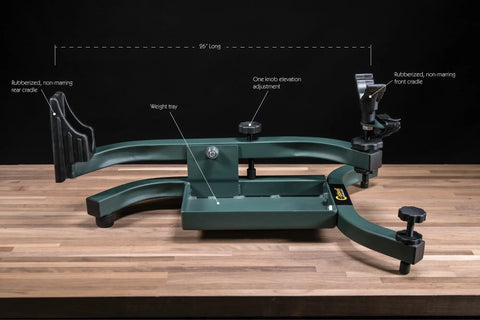 Lead Sled Solo Adjustable Recoil Reducing Rifle Shooting Rest For Range Outdoors And Stability With Height Adjustable Front Support Lever Action Compatible And 25 Pound Weight Tray Heavy Duty Steel Frame on wooden table.