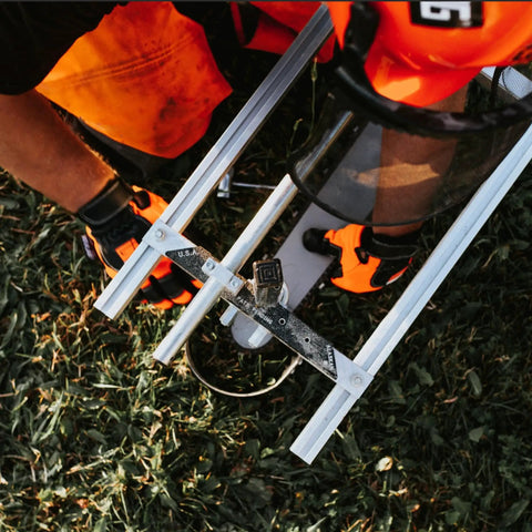 Top view of Alaskan MKIV Chainsaw Mill 30 Inch Portable Sawmill Timber Jig And Wood Cutting Guide during outdoor milling operation