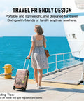 Person with suitcase near docked ship, promoting travel-friendly design for snorkeling and exploration gear.