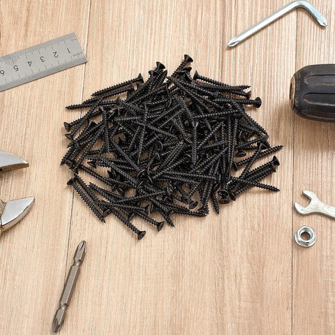 Two Hundred Fifty Black Number Eight By One Inch Half Wood Screws Bulk Box For Cabinet Joinery and Furniture Assembly on wood surface with tools.