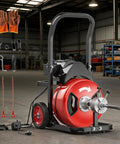 Smooth Operator 100 Feet Electric Drain Auger With 3/4 Inch Steel Core Cable Auto Feed Foot Switch with accessories and gloves.