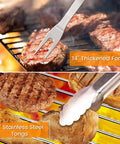 Grill Gear Set With 4-In-1 Spatula, Fork, Tongs And Brush, showing stainless steel fork and tongs handling grilled meat.