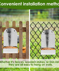 Durable Outdoor Premium Galvanized Steel Oyster Shell And Chicken Grit Feeder Featuring Roomy Hopper Auto Gravity Dispenser mounted on wooden and chain link fences.