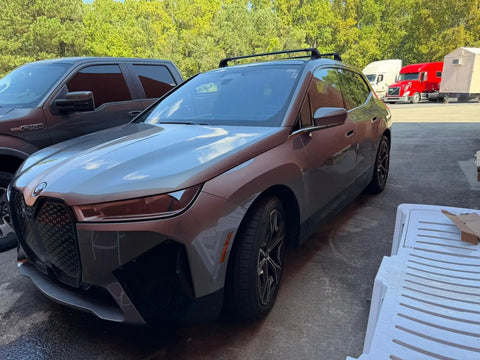 BMW SUV with installed BMW Roof Rack Cross Bars For iX 2020 And Up No Drilling Aluminum T Slot Design Lockable 330 Lbs Load Capacity