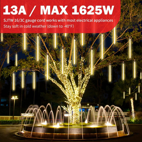Tree with outdoor lights powered by Heavy Duty Outdoor Extension Cord 100 Ft, fountain in foreground, night setting