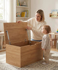 Parent and child exploring a wooden toy box with Two Pack Soft Close Toy Box Hinges With 100N Gas Strut Safety Lid Support installed.