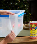 Person applying Thick Rubberized Waterproof Tape For Patching Sealing Leaks And Quick Repairs That Works Underwater And On Dry Surfaces Ideal For Home RV Roof Plumbing And Pool Maintenance Clear 8 In X 5 Ft to plastic container next to a roll of the tape.