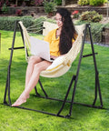 Person sitting on 2 In 1 Outdoor Hammock With Stand Hangout Ready Swing Chair Portable Heavy Duty Steel Frame Backyard Vibe in garden