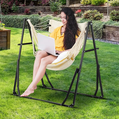 Person sitting on 2 In 1 Outdoor Hammock With Stand Hangout Ready Swing Chair Portable Heavy Duty Steel Frame Backyard Vibe in garden