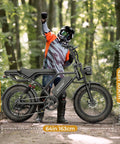 Rider with Beast Mode Electric Fat Tire Mountain Bike With Full Suspension, 1500W Peak Motor, in forest setting.
