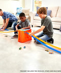 Kids playing with Deluxe Stunt Box Track Builder Playset With 25 Parts And A 1 To 64 Scale Vehicle Easy Build And Quick Cleanup