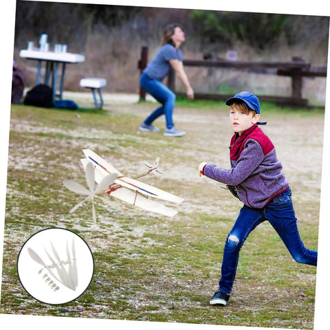 Boy launching model plane in park, inset shows 5 Piece RC Airplane Propeller Blades Rad High Performance Rubber Band Powered Gear for Model Planes Easy Install for Aircraft Gliders and Remote Control Planes Compatible with Various RC Aircraft
