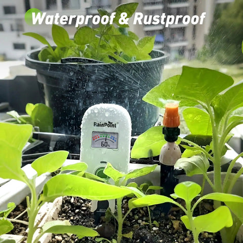Smart Wireless Plant Moisture Meter With Visual Gauge in planter, showing moisture level, surrounded by indoor garden greenery.